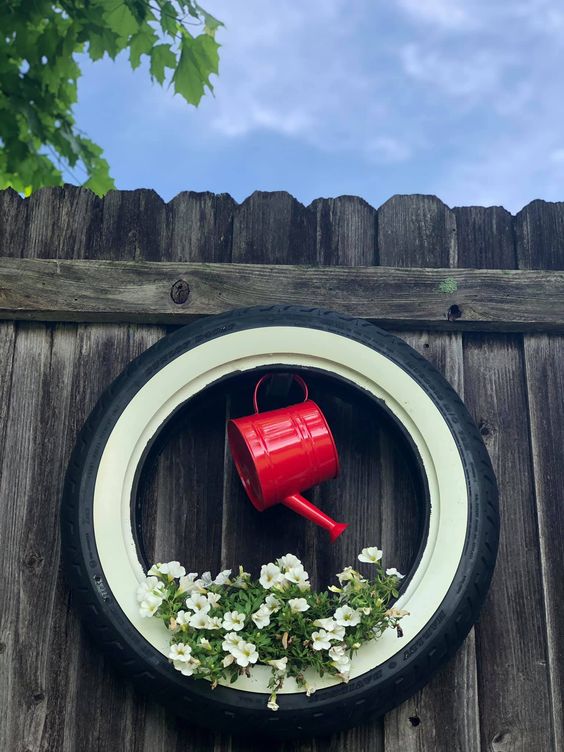 Creative Tire and Watering Can Fence