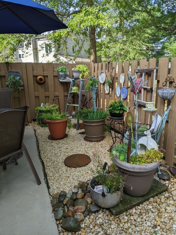 Fence with Hanging Plants and Recycled Decor