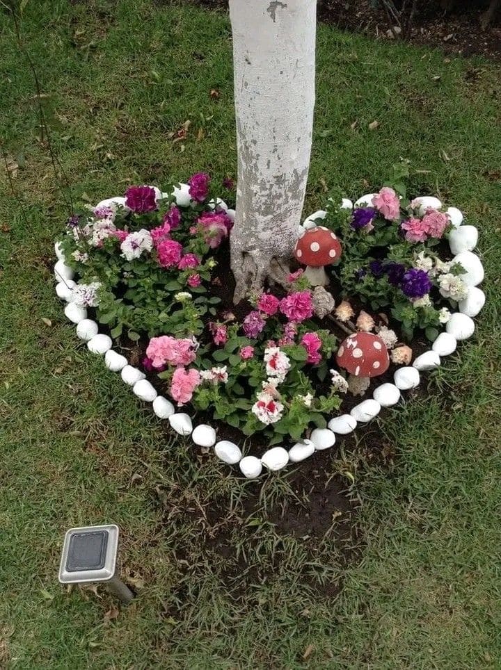 Heart-Shaped Floral Garden Around Tree