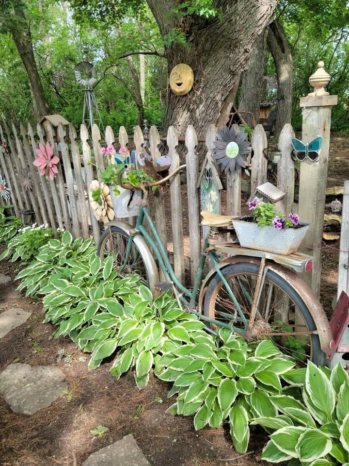 Whimsical Fence with Bicycle Planter and Flower