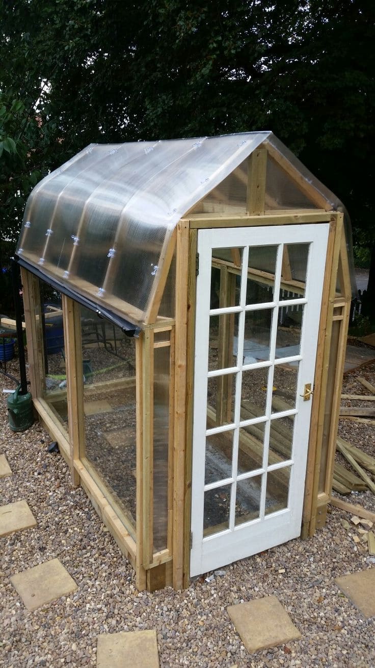 Compact Greenhouse with Curved Polycarbonate Roof