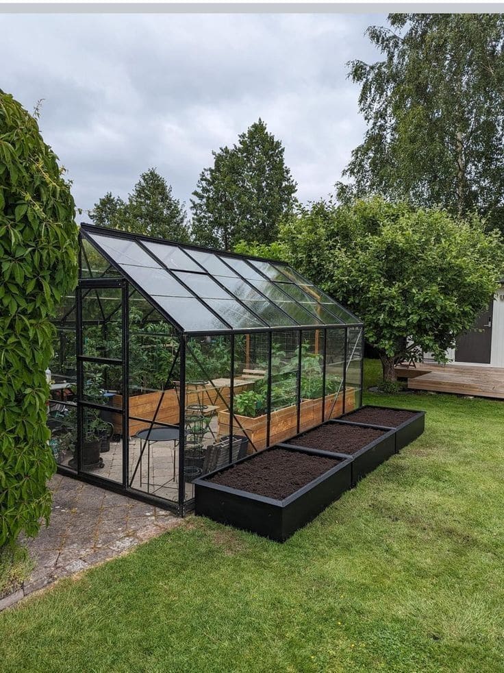 Sleek Modern Greenhouse with Raised Beds