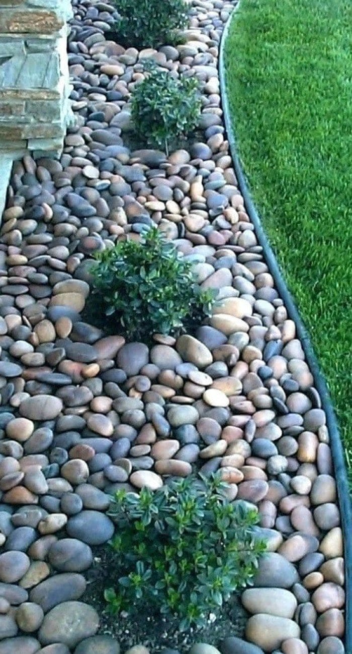 Sleek River Rock Border with Lush Greenery