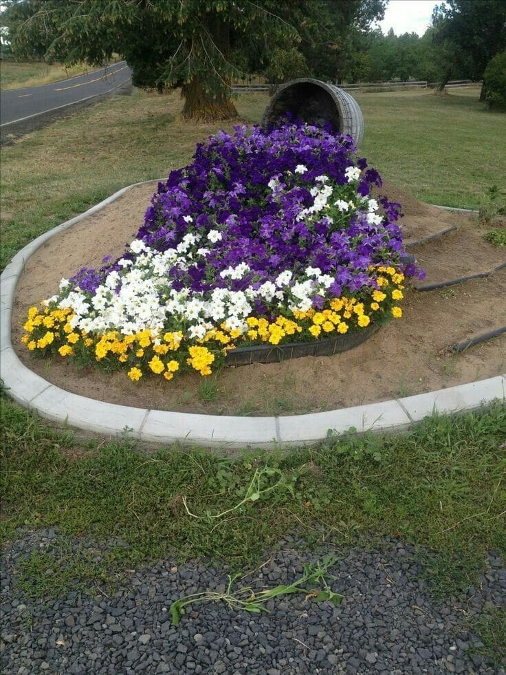 Vibrant Floral Cascade from a Rustic Barrel